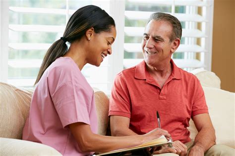 Caregiver smiling with a patient